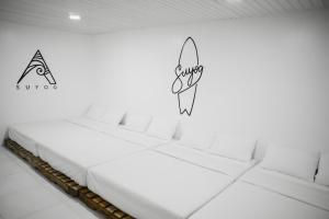 Giường trong phòng chung tại Suyog Life Siargao