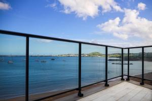 a view of the water from a balcony at Facing Bay Hostel in Praia da Vitória