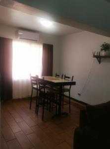 a dining room with a table and chairs at 2-bedroom apartment centrally located, near us consulate in Ciudad Juárez