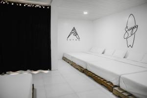 Giường trong phòng chung tại Suyog Life Siargao