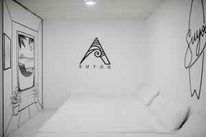 Giường trong phòng chung tại Suyog Life Siargao