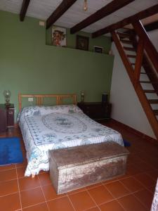 a bedroom with a large bed with a wooden headboard at End of the World in Tablado de la Montañeta