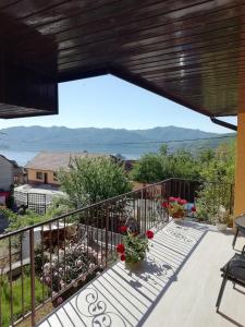 a balcony with a view of the water at Casa Darius in Orşova