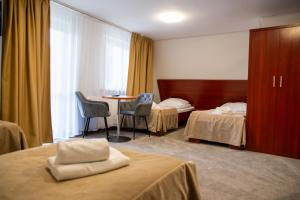 Posteľ alebo postele v izbe v ubytovaní POŁONINY Resort