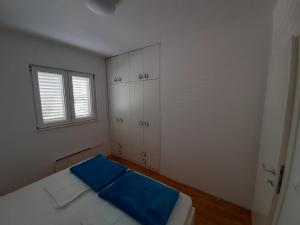 Posteľ alebo postele v izbe v ubytovaní Apartman u centru Makarske