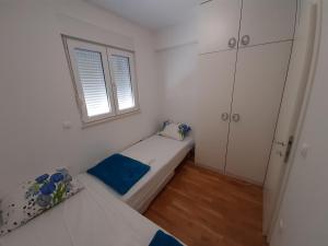 Posteľ alebo postele v izbe v ubytovaní Apartman u centru Makarske