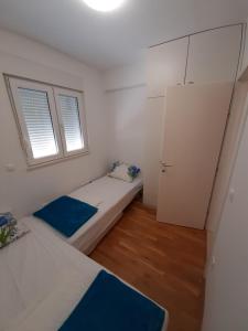Posteľ alebo postele v izbe v ubytovaní Apartman u centru Makarske