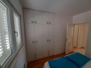 Posteľ alebo postele v izbe v ubytovaní Apartman u centru Makarske