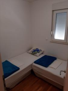 Posteľ alebo postele v izbe v ubytovaní Apartman u centru Makarske