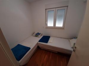 Posteľ alebo postele v izbe v ubytovaní Apartman u centru Makarske