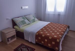 Postel nebo postele na pokoji v ubytování Apartmani Pucarin