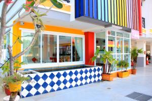 a store front with a brightly colored at The Cottage Lampang in Lampang