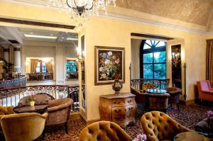 a living room filled with furniture and decor at Palazzo Hotel in Johannesburg