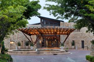 a building with a wooden structure with lights on it at Arabella Hotel, Golf and Spa in Kleinmond