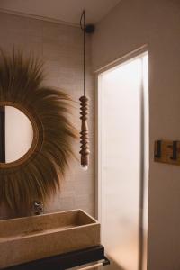 a bathroom with a mirror and a sink at Laguna Suite B&B in Chioggia