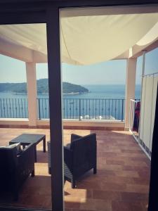 a view of the ocean from the balcony of a house at Villa Ragusa in Dubrovnik