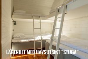 Postelja oz. postelje v sobi nastanitve Nimbus Öckerö Boende