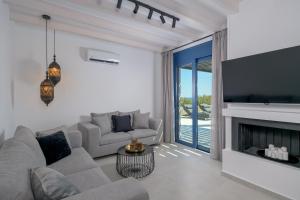 A television and/or entertainment centre at Astrea Villas