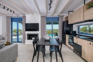 A kitchen or kitchenette at Astrea Villas