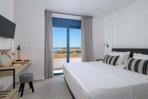 A bed or beds in a room at Astrea Villas
