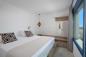 A bed or beds in a room at Astrea Villas
