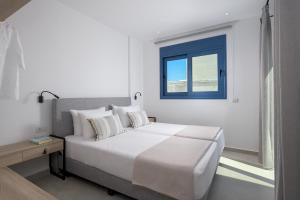 A bed or beds in a room at Astrea Villas