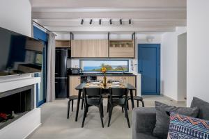 A kitchen or kitchenette at Astrea Villas