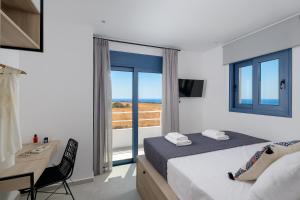 A bed or beds in a room at Astrea Villas