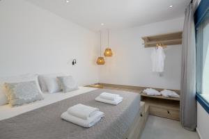 A bed or beds in a room at Astrea Villas