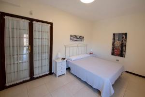Posteľ alebo postele v izbe v ubytovaní Vivienda Vacacional Villa El Mirador
