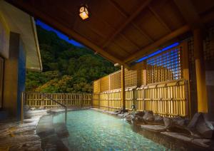 a pool of water inside of a building at Hakone Pax Yoshino in Hakone