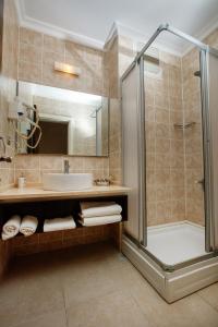 a bathroom with a shower and a sink at SUENA HOTEL Çeşme in Çeşme +28 photos