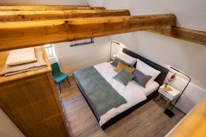 Кровать или кровати в номере Auszeithaus Pilsum - Wintergarten, Sauna, E-Ladesäule - 8 Personen