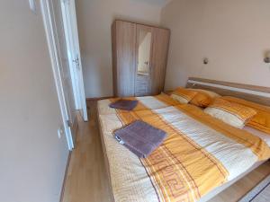Postel nebo postele na pokoji v ubytování Cserke Napfény Apartman