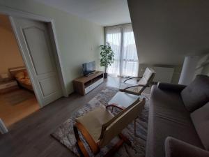 Posezení v ubytování Cserke Napfény Apartman