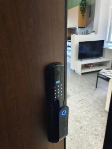 a remote control is attached to a door at GREEN HOUSE in Kardítsa