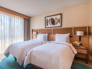 The Bodrum Hotel Yalikavak - MGallery Collection客房内的一张或多张床位