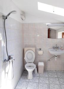 a bathroom with a toilet and a sink at Top floor apartment in the Center of Pomorie in Pomorie