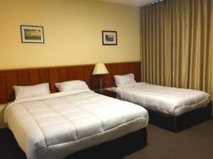 Regency Hotel Hebron客房内的一张或多张床位