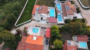 an overhead view of a house with orange roofs at Apartments Villa Mimi in Višnjan