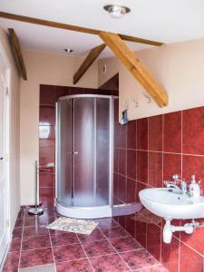 a bathroom with a shower and a sink at Amber in Liepāja