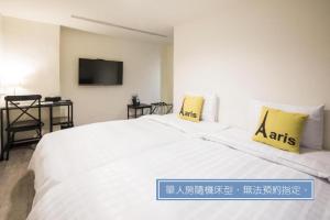 Voodi või voodid majutusasutuse Home Rest Hotel toas