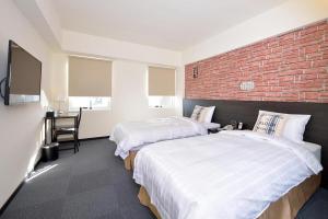 Voodi või voodid majutusasutuse Home Rest Hotel toas