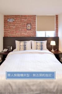Voodi või voodid majutusasutuse Home Rest Hotel toas