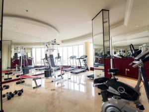 a gym with a bunch of treadmills and machines at Lotaz Hotel - Al Shatea in Jeddah