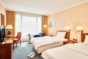 Postel nebo postele na pokoji v ubytování co56 Hotel Chemnitz
