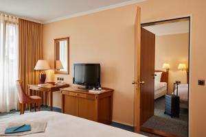 Postel nebo postele na pokoji v ubytování co56 Hotel Chemnitz + 36 fotografií