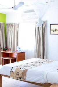 Voodi või voodid majutusasutuse The Ad Lib Executive lodge toas