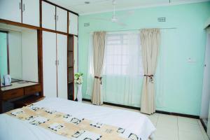 Voodi või voodid majutusasutuse The Ad Lib Executive lodge toas