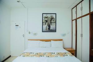 Voodi või voodid majutusasutuse The Ad Lib Executive lodge toas